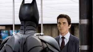 Bruce Wayne removing Batman mask