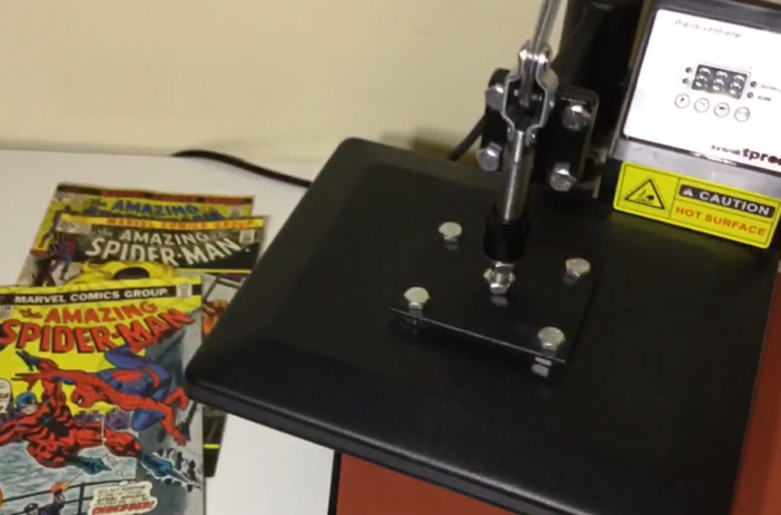 Comic book being carefully pressed flat