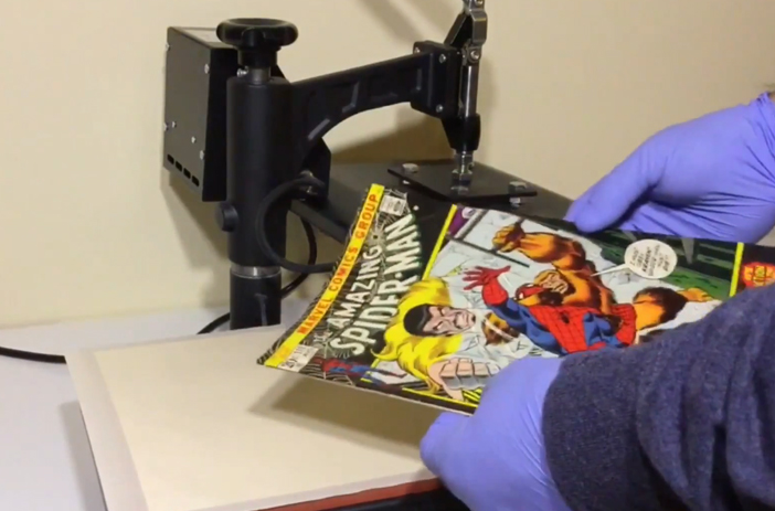 Collector examining comic book condition carefully