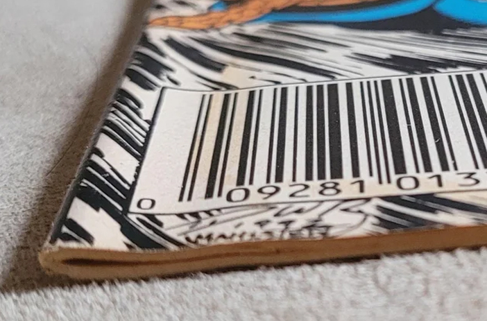 Comic book spine with visible bend crease