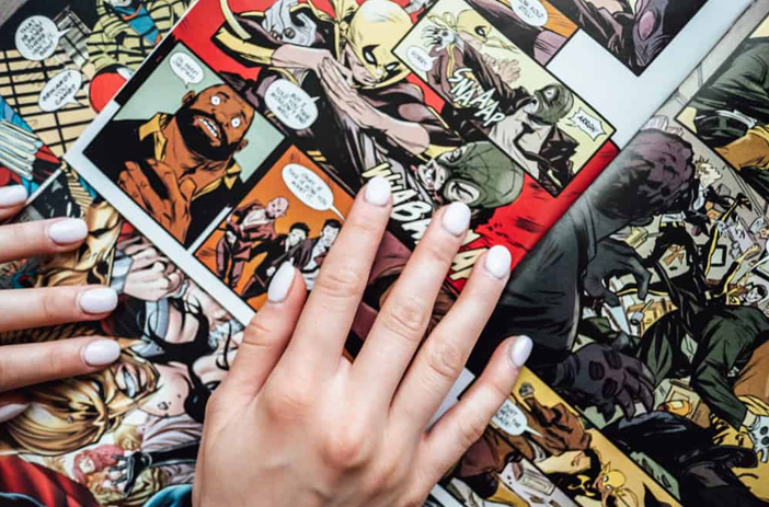Vintage comic books stacked by decade
