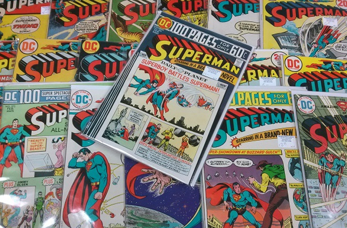 Vintage comic books stacked in store bins