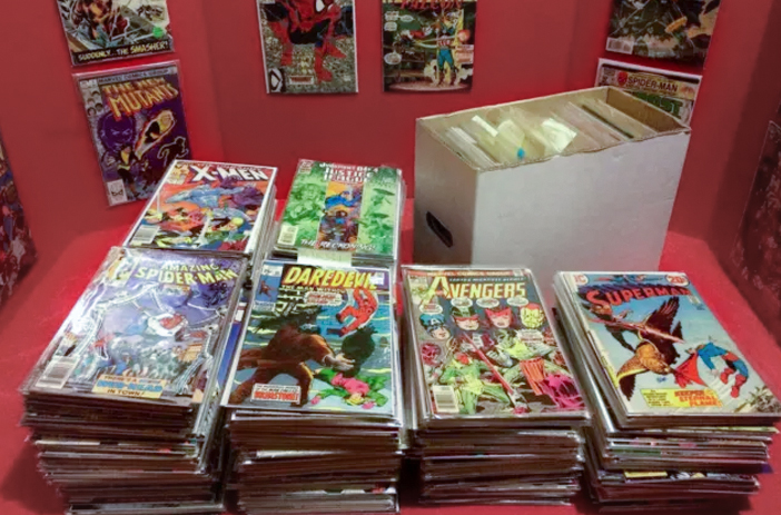 Stack of unsorted comic books for sale