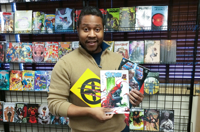 Person sorting individual comic books carefully
