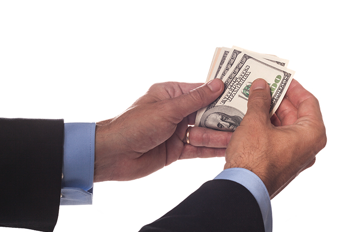 Broker receiving payment after successful comic sale