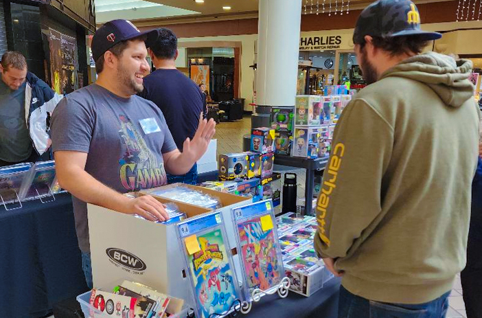 Comic book convention vendor booth setup