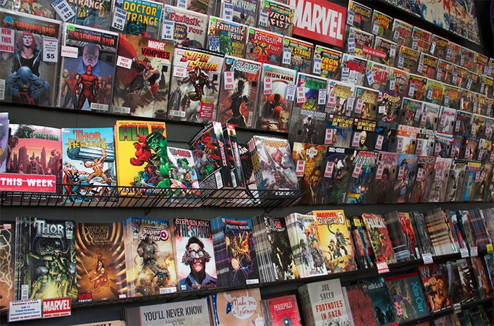 Stacked vintage comic books on shelf
