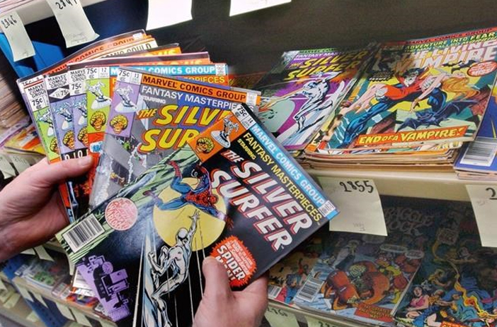 Person organizing comic books for sale