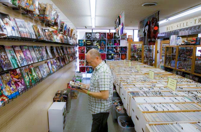Person looking confused at comic books