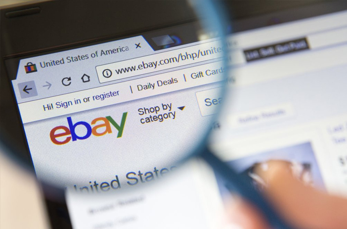 Person browsing comic prices on eBay