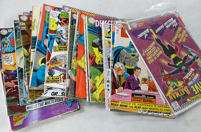 Person examining comic book condition closely