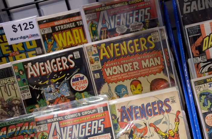 Auctioneer presenting comics at auction house