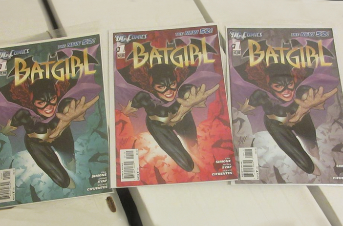 Stack of comic books with ratio variants