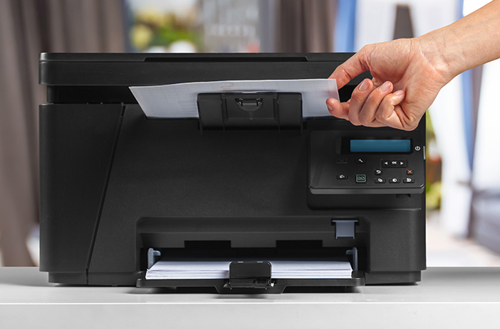 Flatbed scanner next to comic books