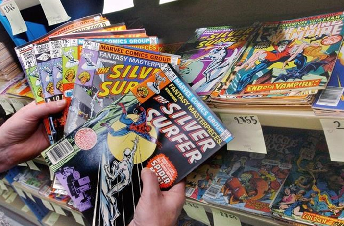 Person examining comic book barcode closely