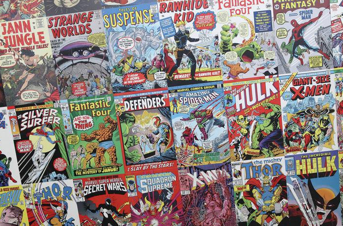 Stack of colorful comic books on table
