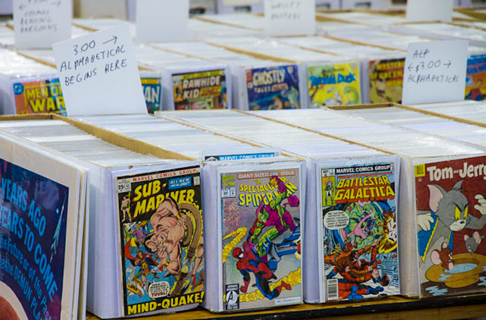 Comic books sorted in organized display boxes
