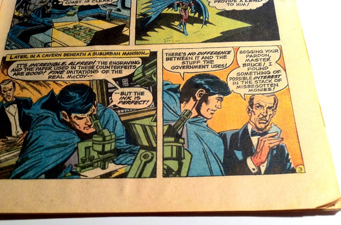 Comic book pages being carefully restored