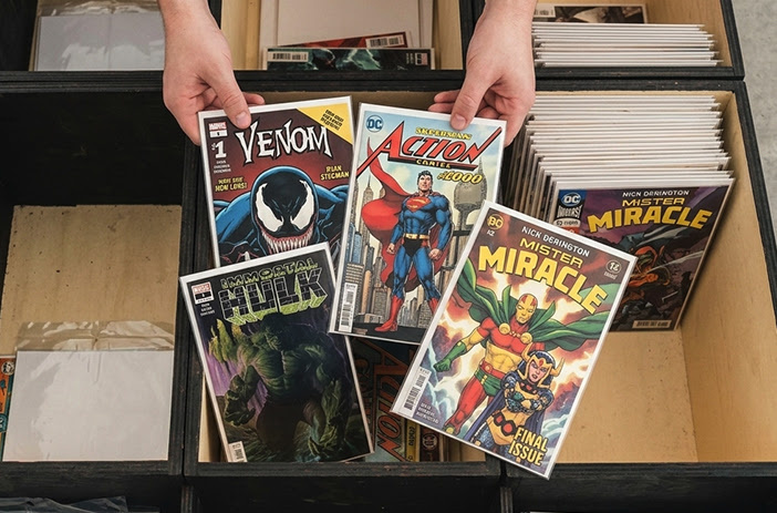 Insurance adjuster reviewing comic book collection value
