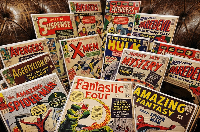 Stack of comic books with tax documents