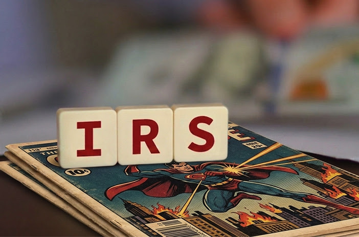 Stack of comic books with tax forms