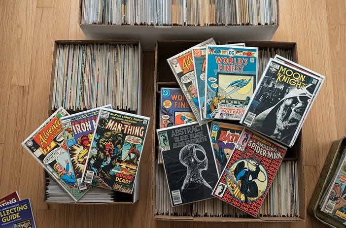 Comic books spread on appraisal table