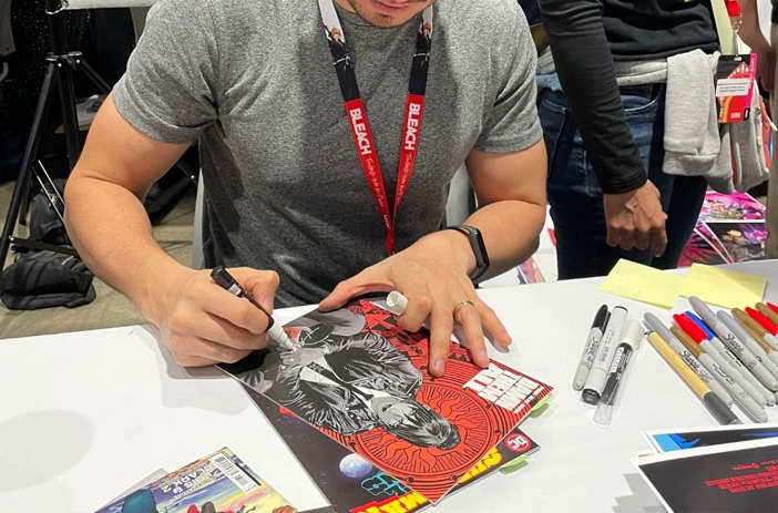 A Comic Book Being Signed