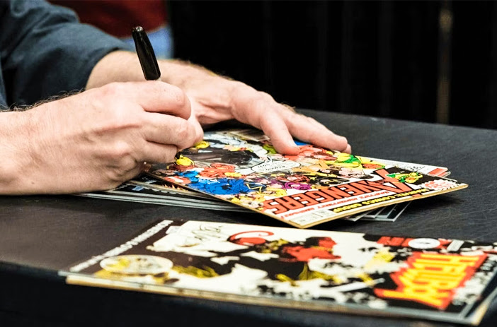Comic Books Being Autographed
